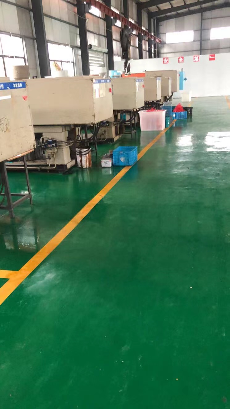 Injection molding production equipment inside the factory